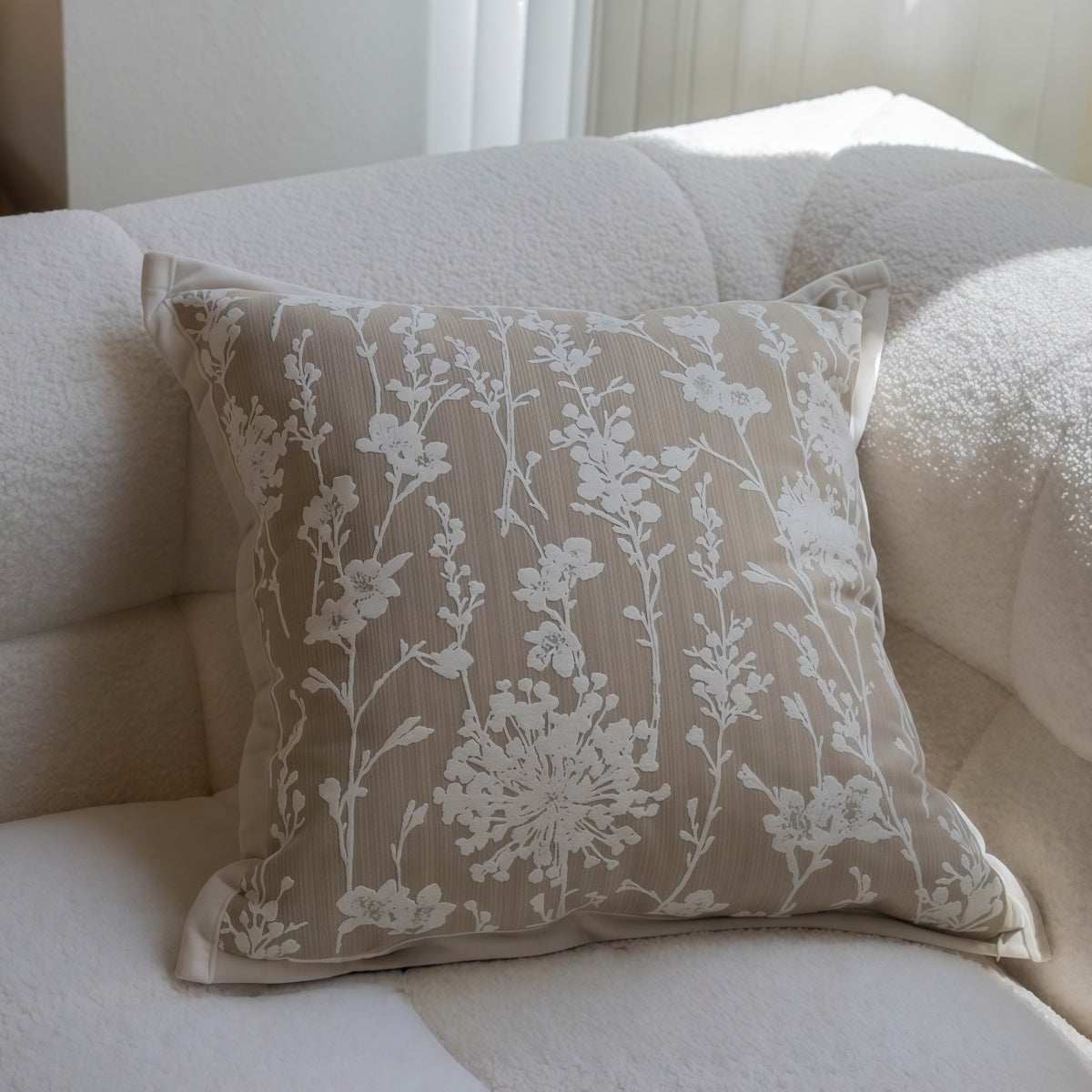 French-Style Embroidered Throw Pillow in taupe blended fabric, featuring white floral embroidery and a square shape.