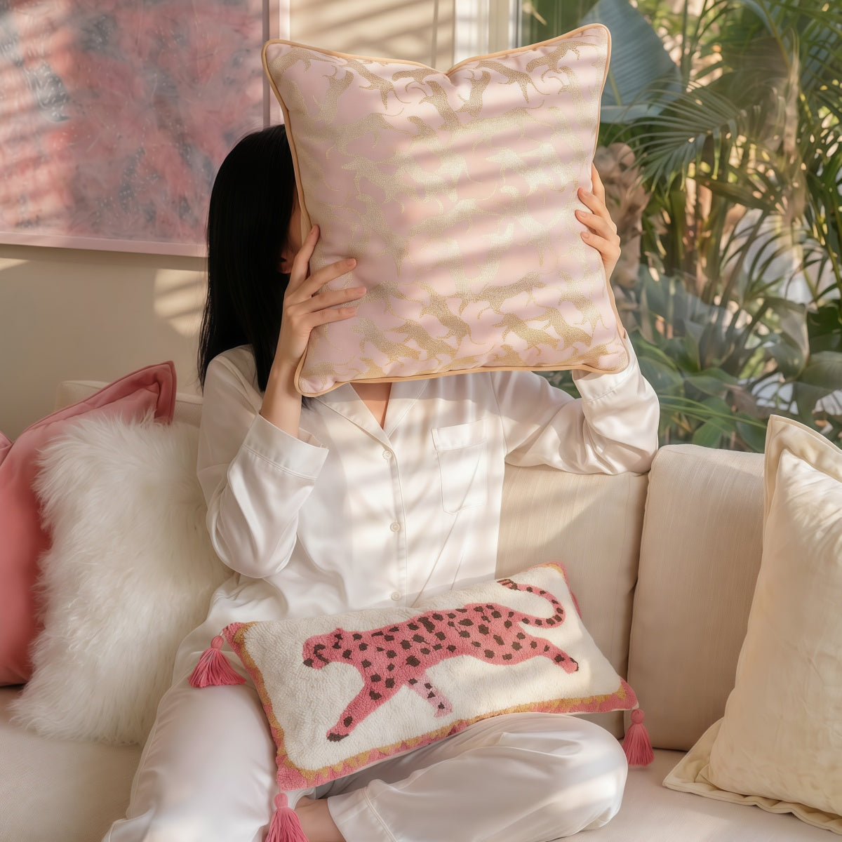 French-Style Pink Leopard-Pattern lumbar throw pillow, cream boucle with a pink spotted leopard motif and tassel corners.