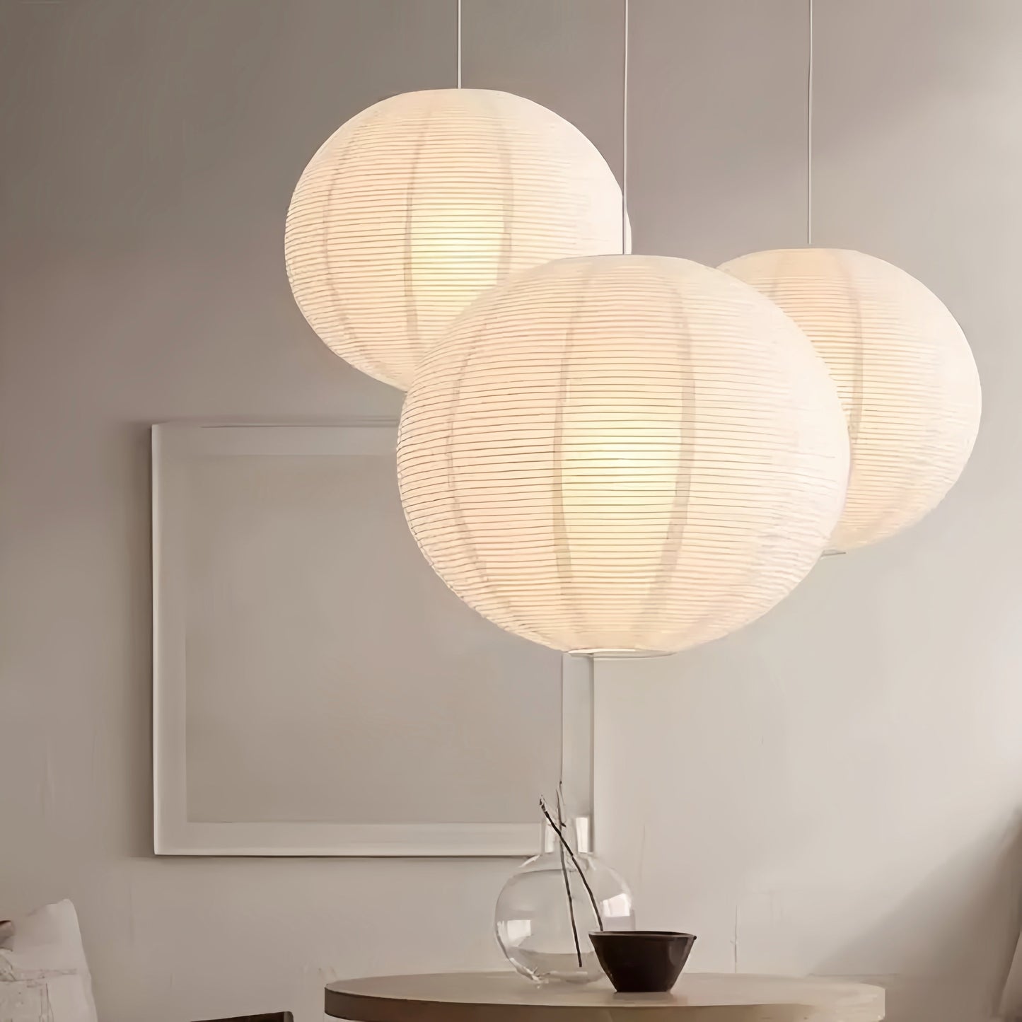 Noguchi Isamu rice paper pendant light fixture hanging from ceiling
