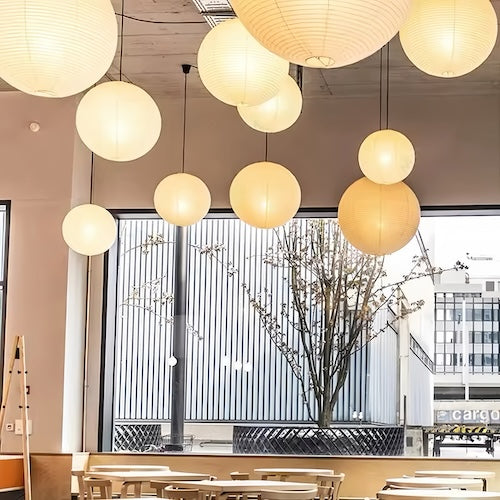 Noguchi Isamu rice paper pendant light fixture hanging from ceiling