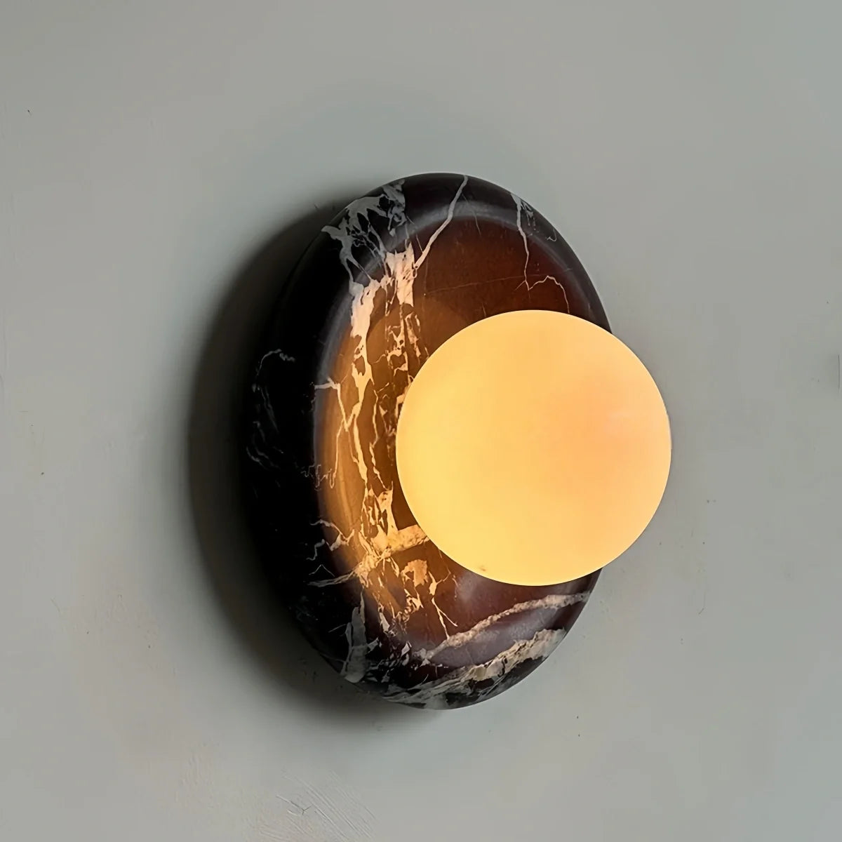 Natural travertine marble wall sconce with textured yellow marble and warm LED light for hotel and bedroom ambiance