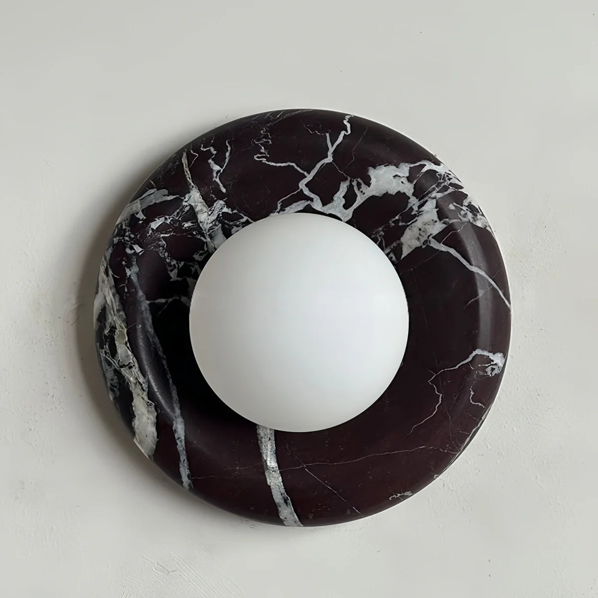 Natural travertine marble wall sconce with textured yellow stone and warm LED light for bedroom and hallway ambiance