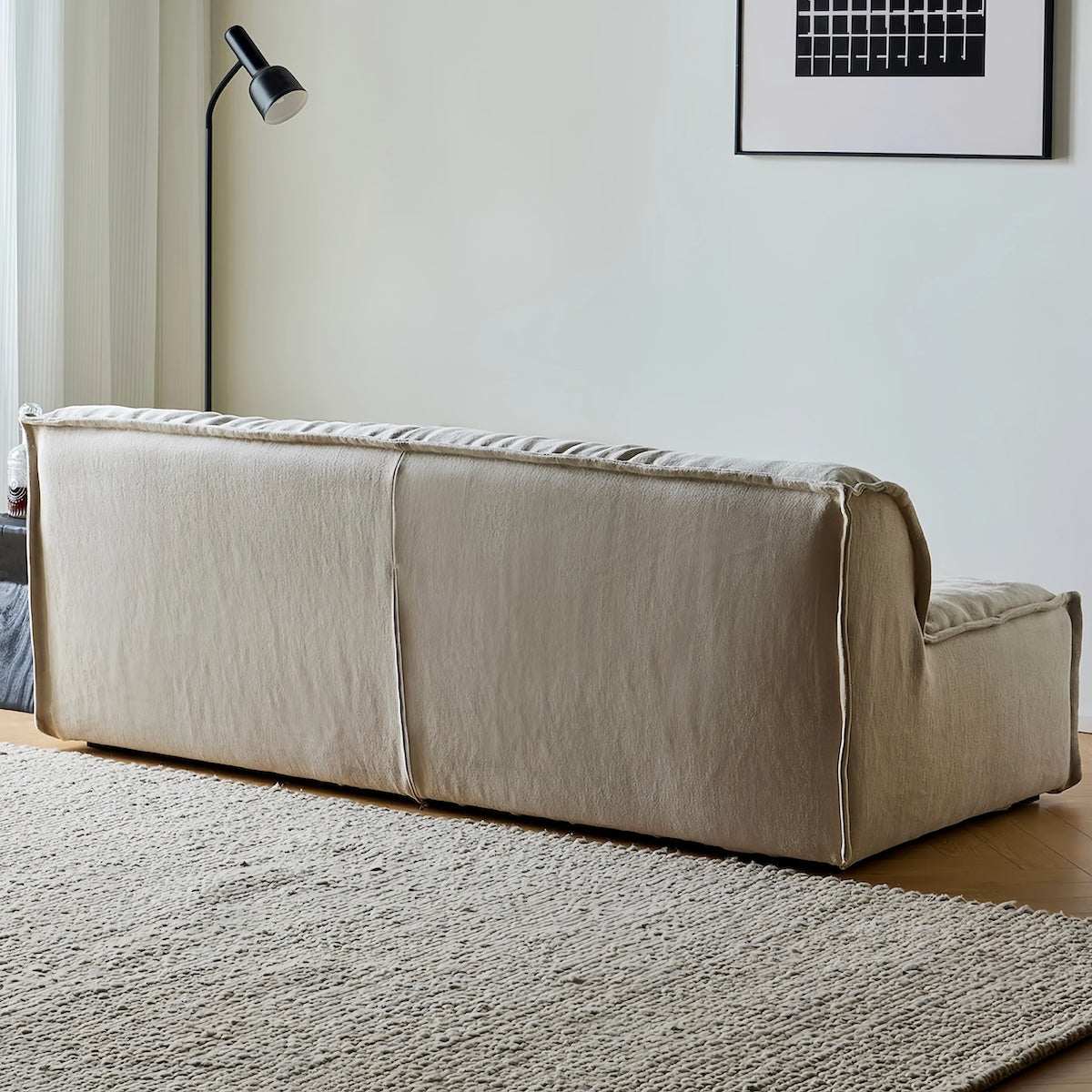 Armless linen sofa with natural wrinkles and washable covers in minimalist wabi-sabi style for small spaces