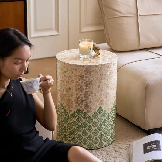 Luxury shell-inspired cylindrical side table handcrafted from natural materials, durable and versatile accent piece