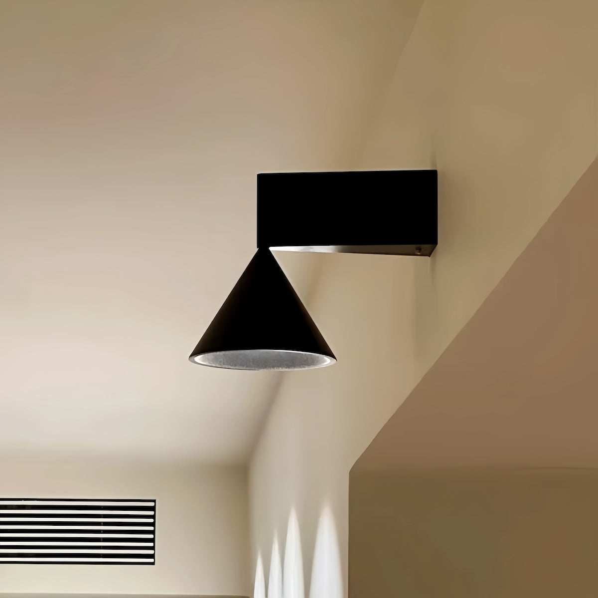 Italian minimalist modern wall sconce with conical aluminum shade and warm LED light for hallway and bedroom