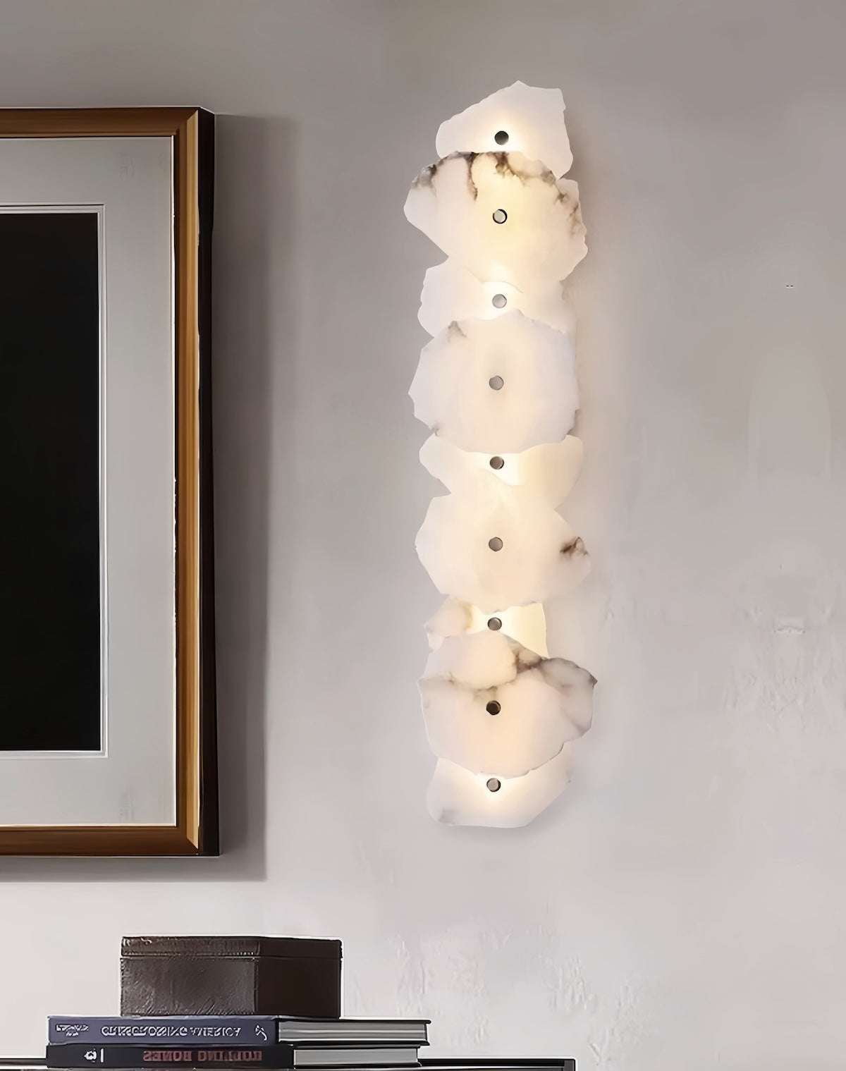 modern marble wall light with multiple white marble discs and copper accents on wall