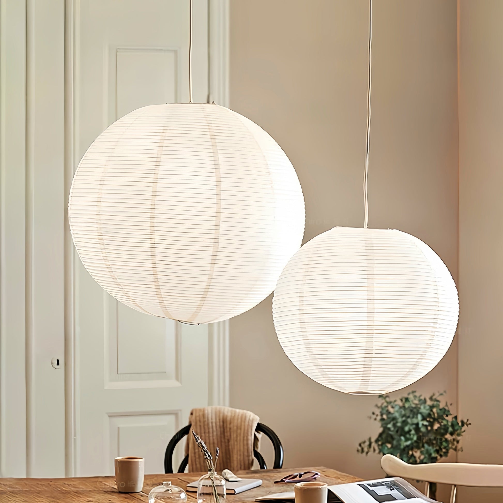 Noguchi Isamu rice paper pendant lighting fixture illuminating a room