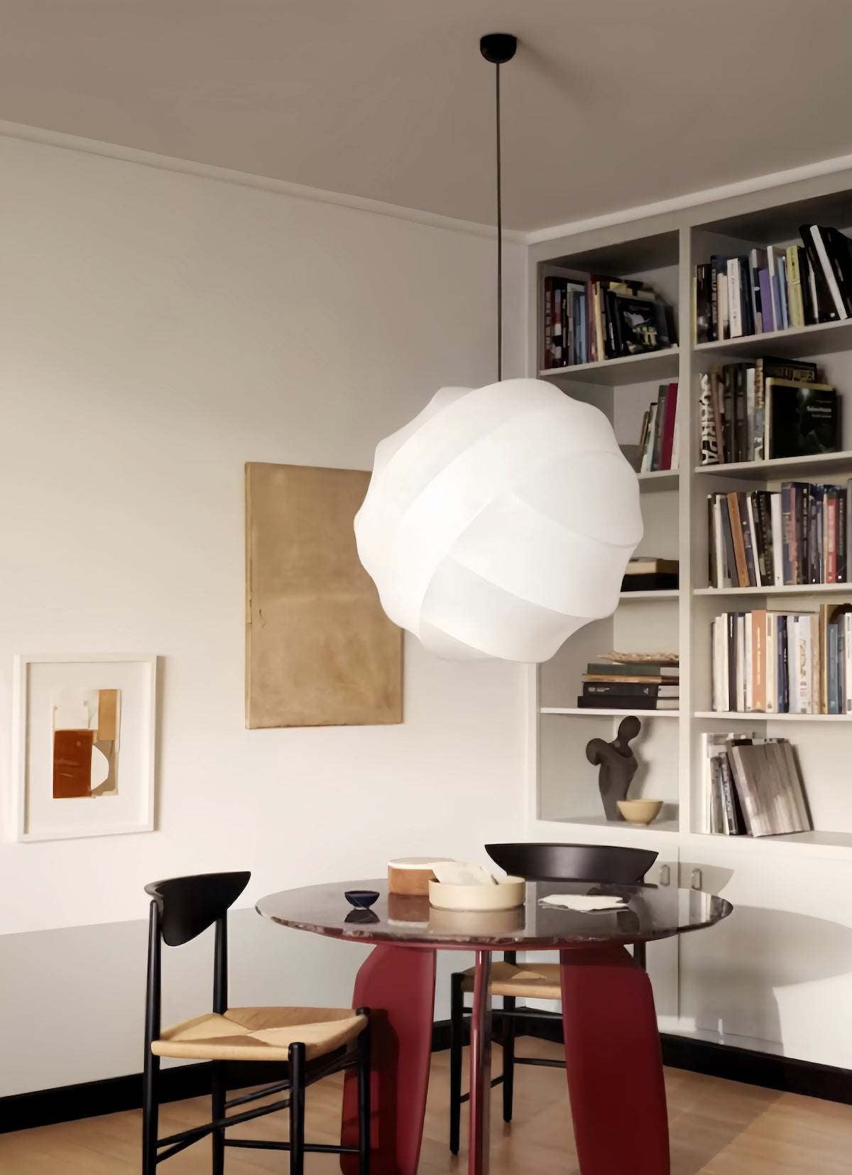 Wabi-Sabi Silk Pendant Light with hand-crafted silk shade casting warm, diffused glow over modern dining table and chairs in minimalist living space