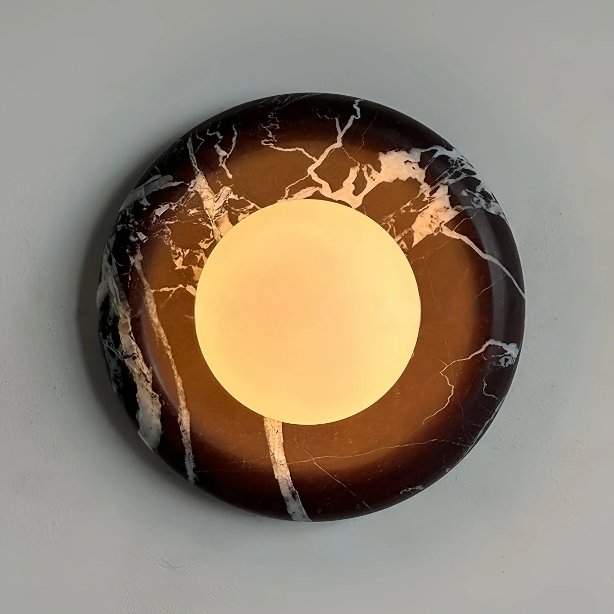Natural travertine marble wall sconce with textured yellow stone and warm LED light for hotel and bedroom ambiance
