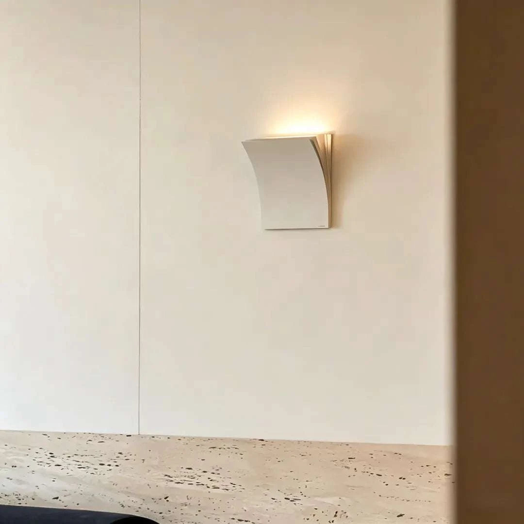 Book-shaped wall sconce with matte metal finish and warm white LED light for modern minimalist decor in living rooms and hallways