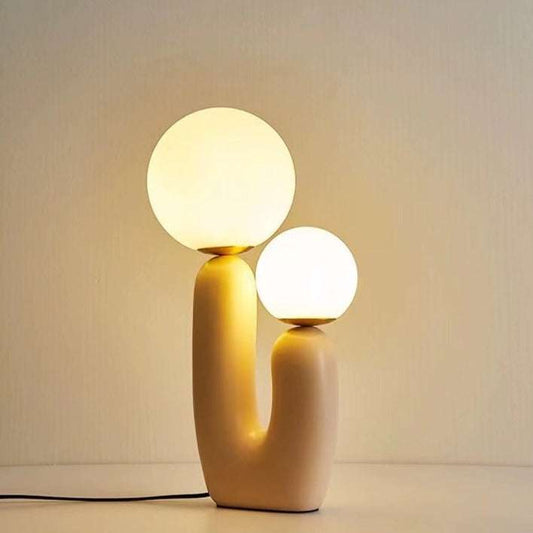Minimalist tall table lamp with resin base and dual glowing glass spheres