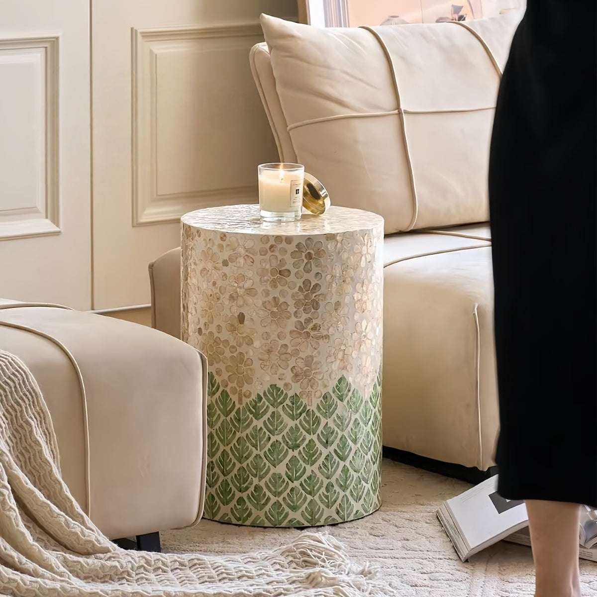 Luxury shell-inspired side table with classic cylindrical design, handcrafted natural materials, and versatile indoor-outdoor use