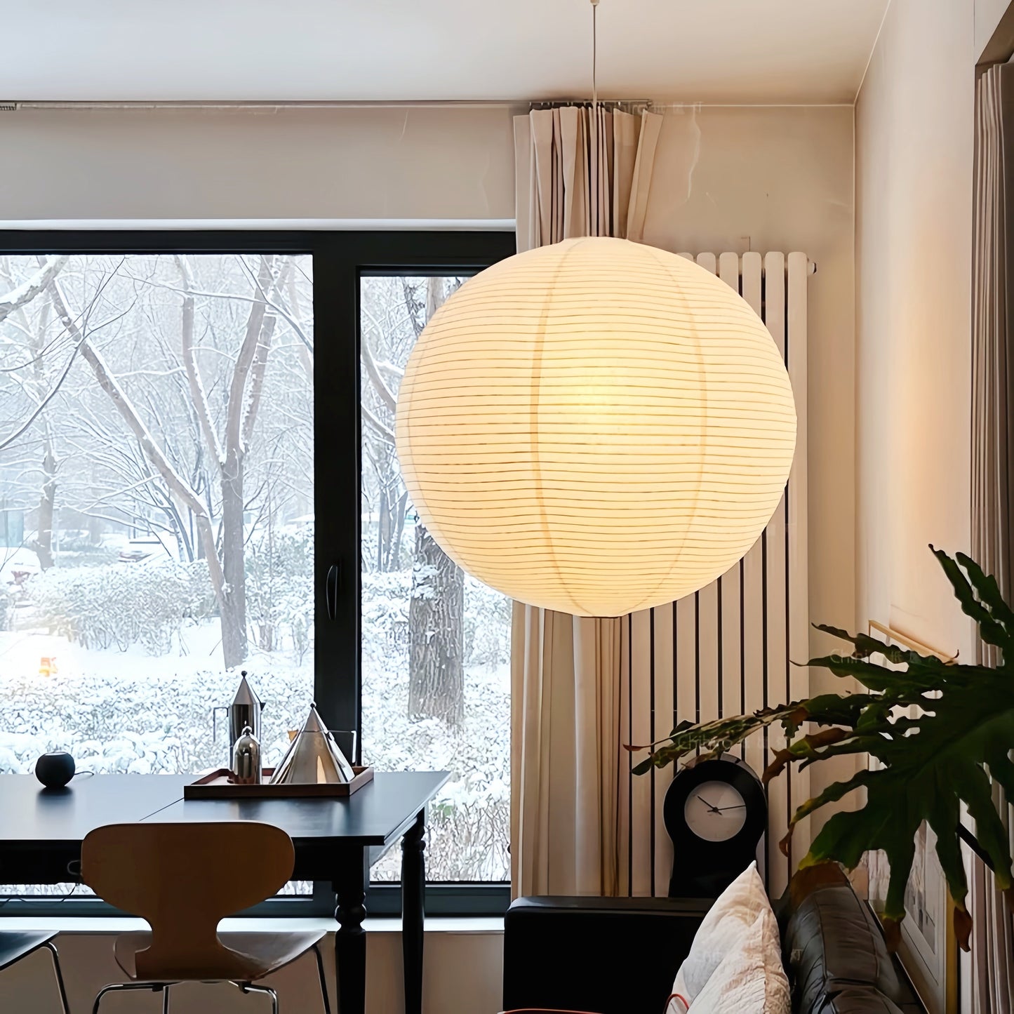 Noguchi Isamu rice paper pendant lighting fixture hanging from ceiling