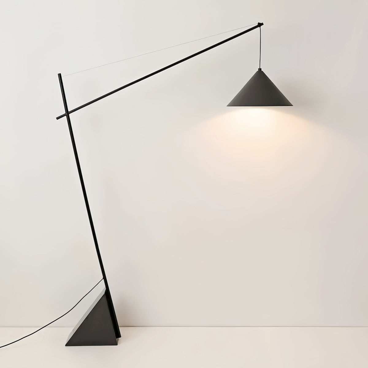 Minimalist Italian floor standing lamp with warm LED ambient light for modern living rooms and bedrooms