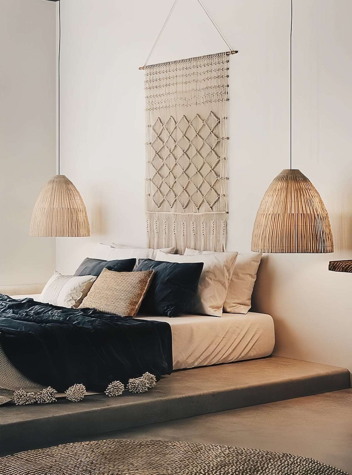 Cream-colored rattan pendant light with woven design and warm glow for cozy bohemian decor