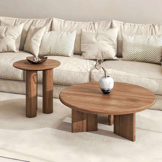 Wabi Sabi solid wood round coffee table and side table with natural wood grain in rustic living room setting