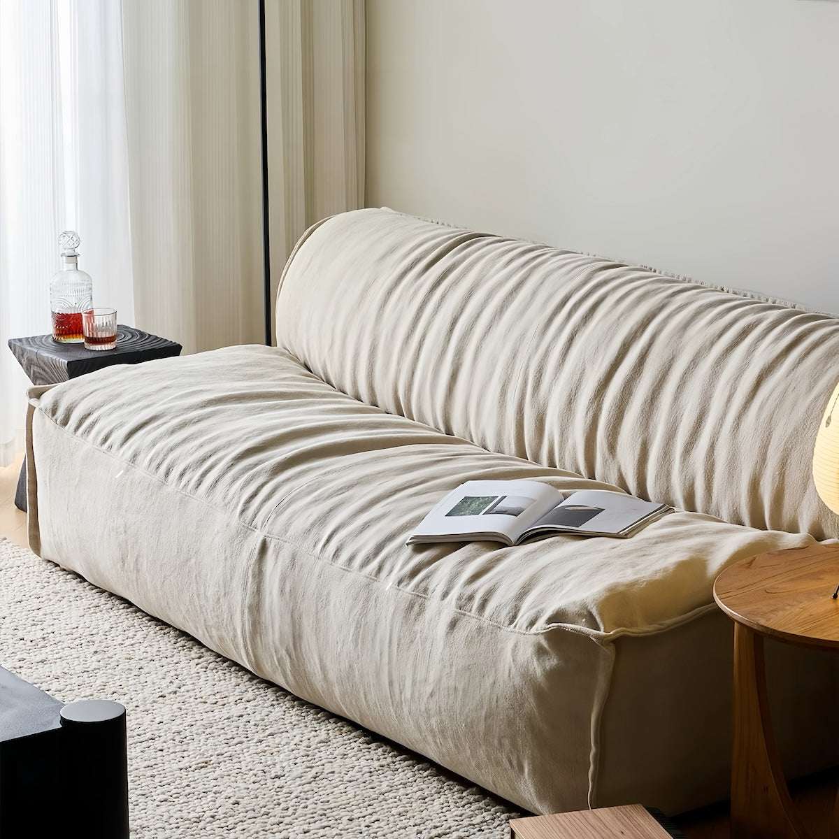Armless linen sofa with natural wrinkles and washable covers in minimalist wabi-sabi design for small spaces