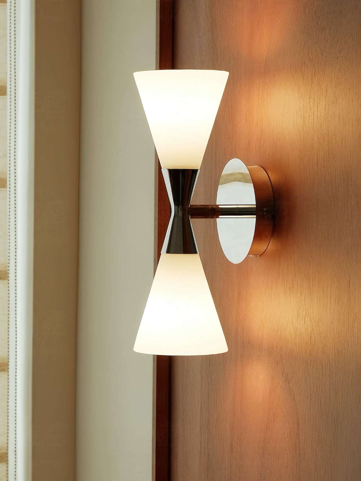Nordic modern hourglass wall sconce with frosted glass and chrome finish for living room and bedroom lighting