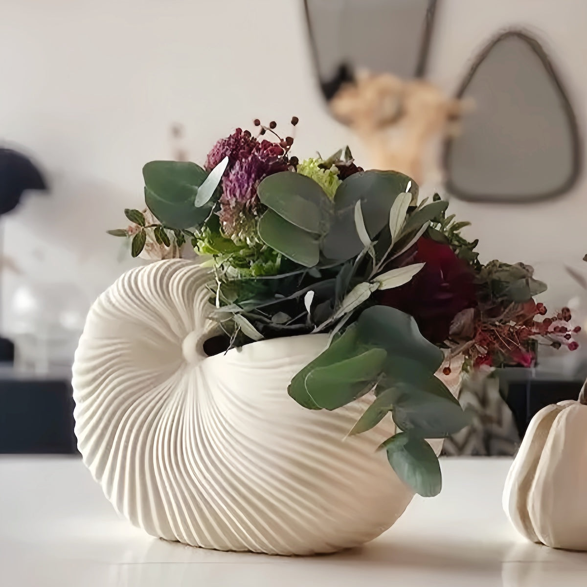 Elegant white ceramic seashell vase with dried flowers, Nordic style decor for modern homes