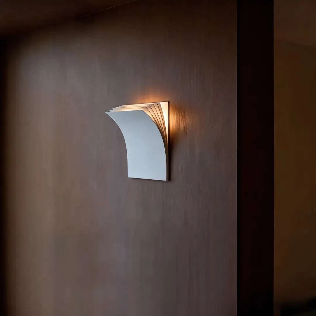 Minimalist book-shaped wall sconce with matte black iron frame and warm white LED light for living room and hallway decor