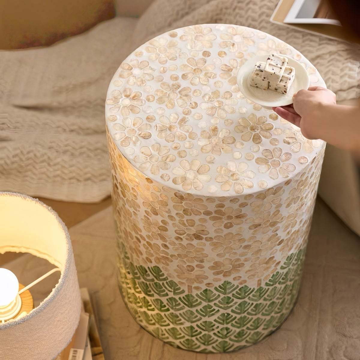 Luxury shell-inspired cylindrical side table with handcrafted natural materials and minimalist design