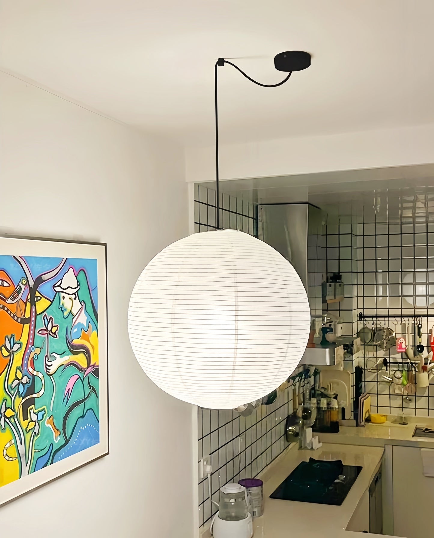 Noguchi Isamu rice paper pendant lighting fixture hanging from ceiling