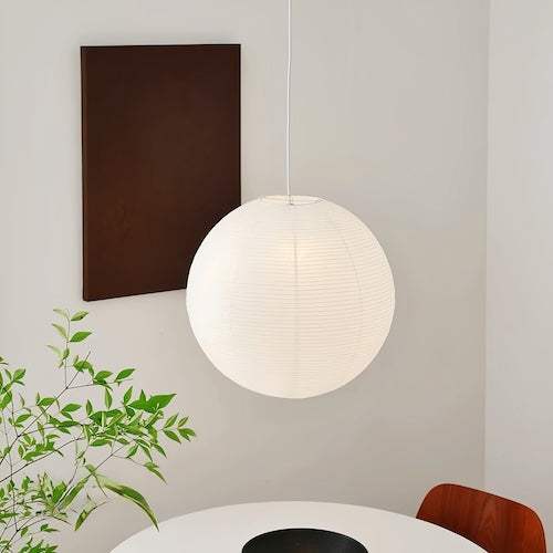 Noguchi Isamu rice paper pendant lighting fixture hanging from ceiling