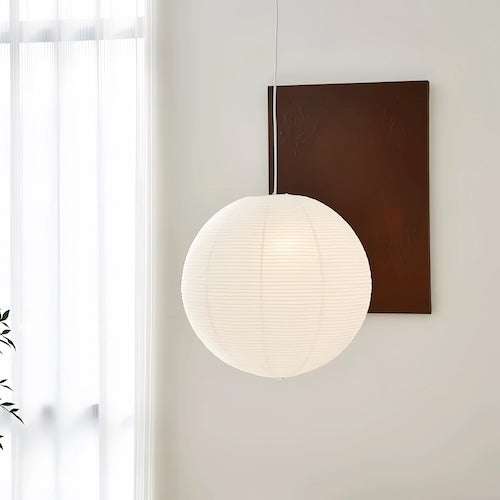 Noguchi Isamu rice paper pendant lighting fixture hanging from ceiling