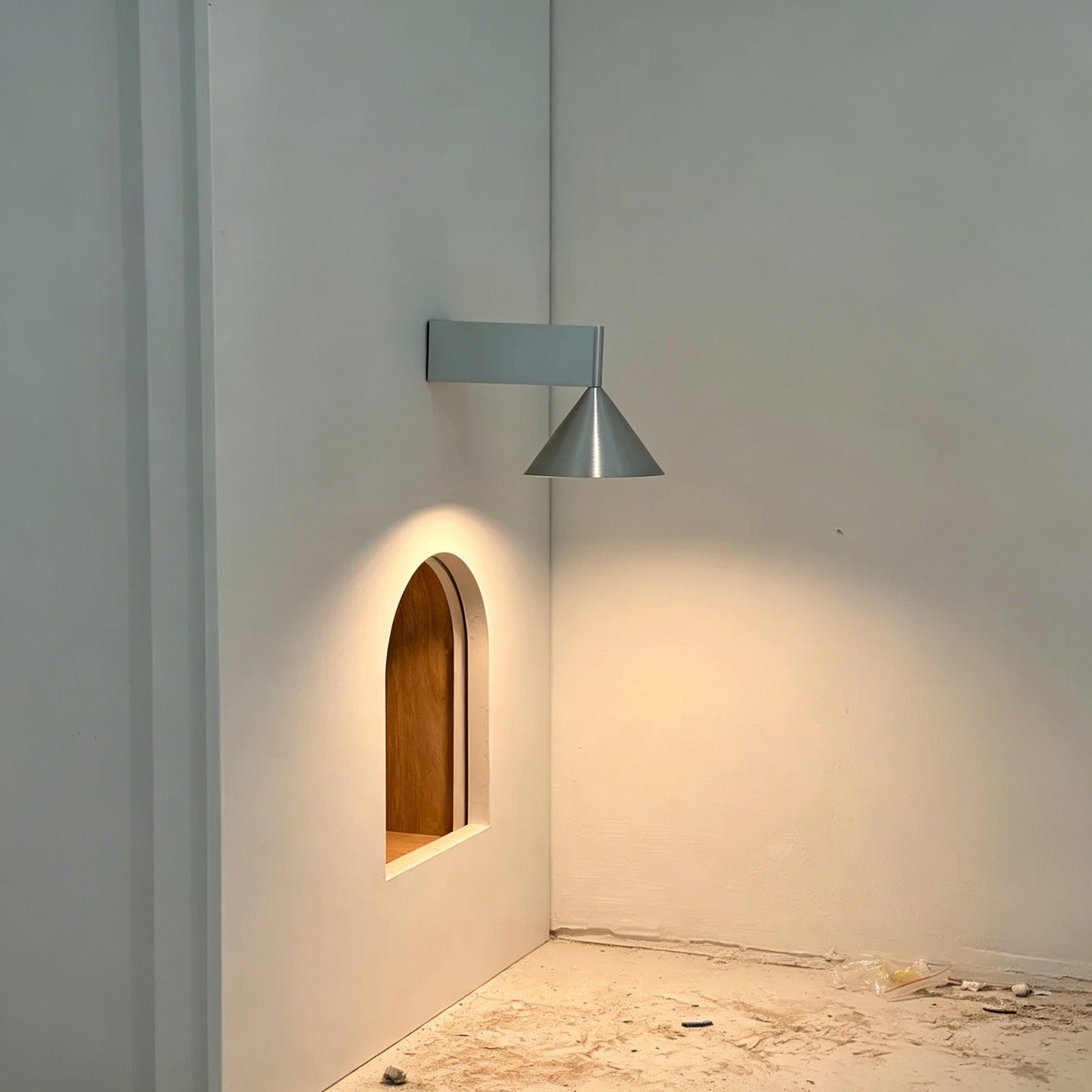 Italian minimalist modern wall sconce with conical aluminum shade and warm 3000K LED light