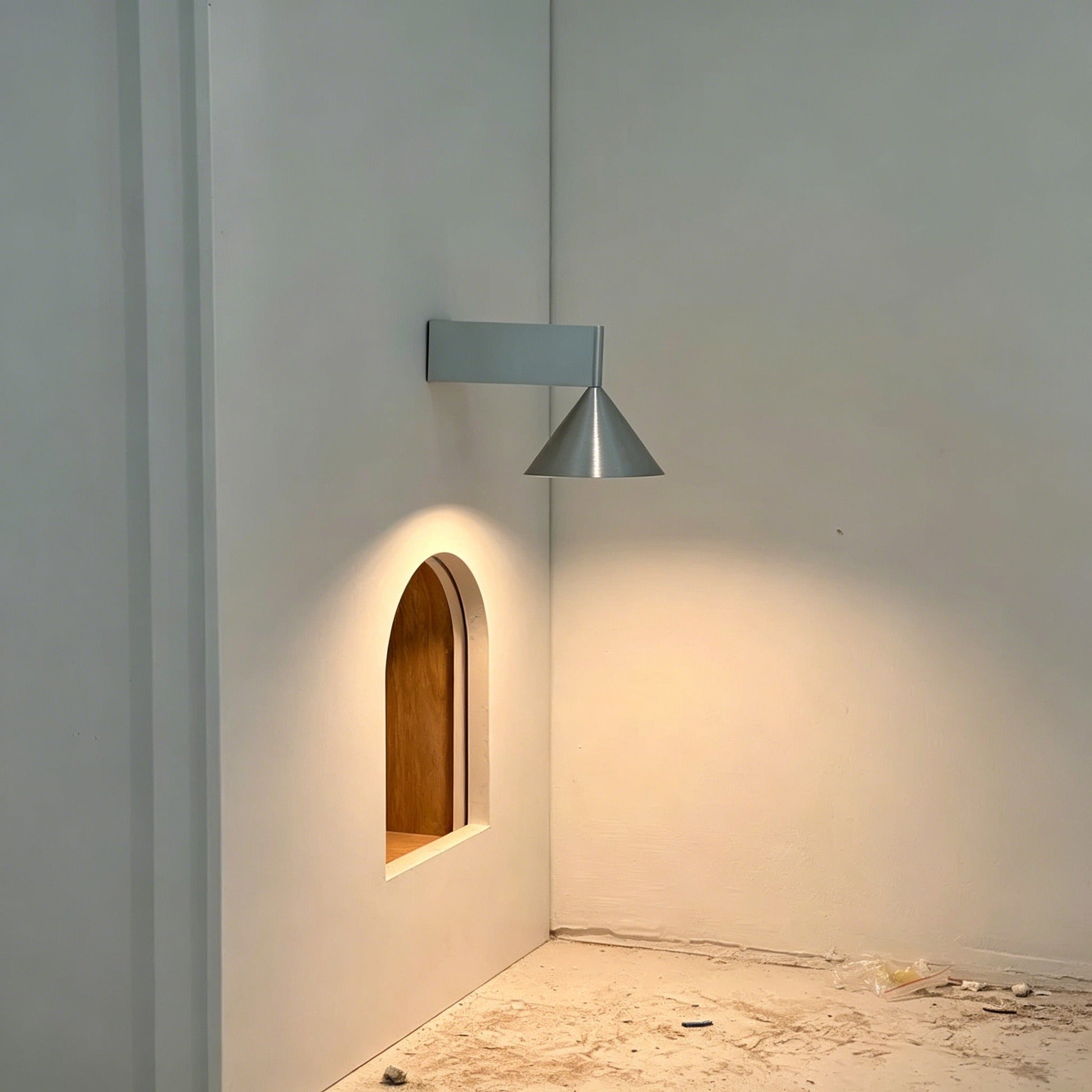 Italian minimalist modern wall sconce with conical aluminum shade and warm 3000K LED light