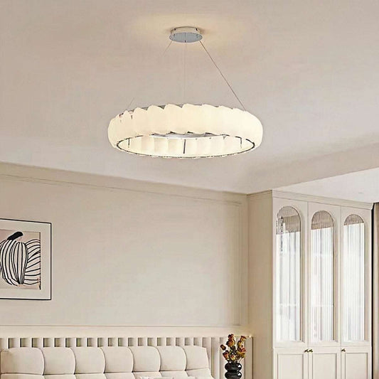 Modern ring pendant light with soft creamy glow and minimalist design hanging in living room