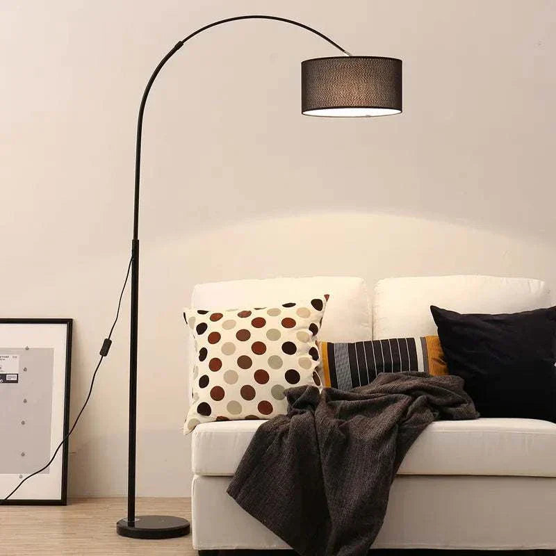 Modern adjustable LED floor lamp with fabric shade in black, perfect for living room lighting.