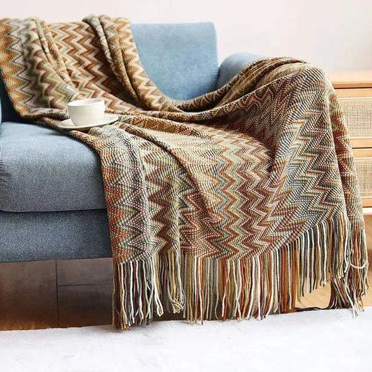 Boho corner sofa cover with plaid pattern and fringe, soft polyester cotton blend blanket on blue sofa