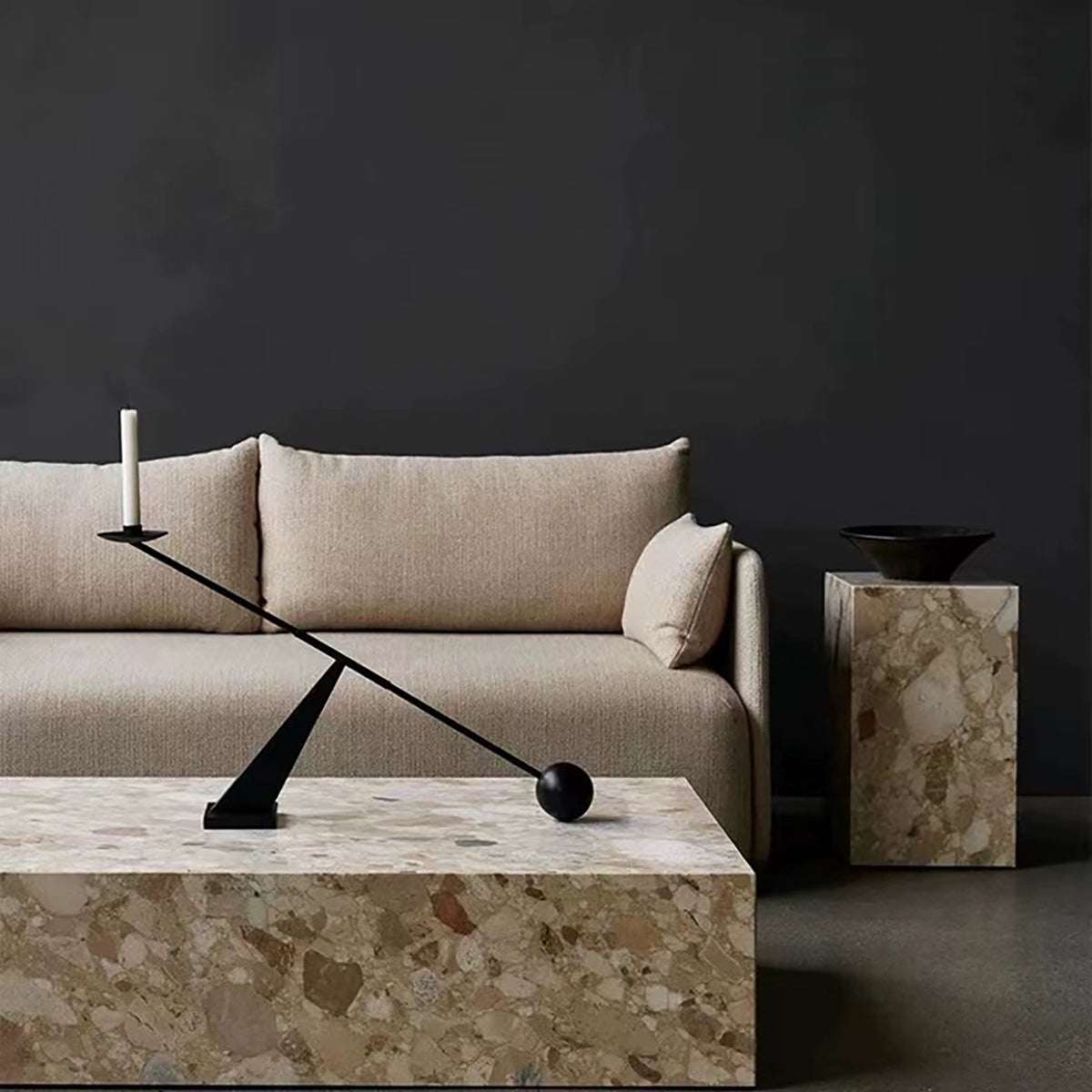Black geometric modern minimalist black candle holder on marble table in elegant living room setting