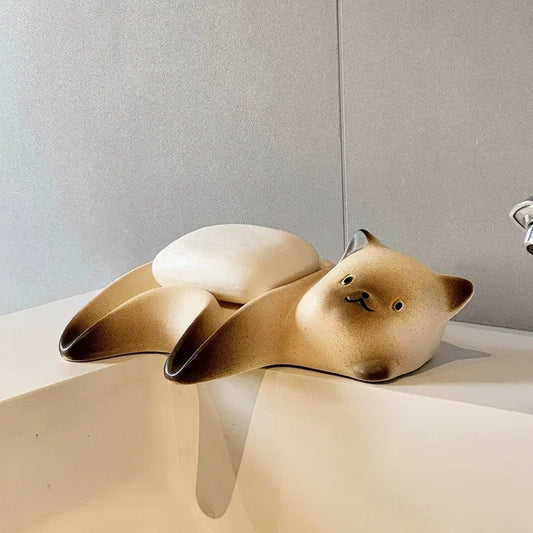 Ceramic cat soap dish with Siamese cat design and drainage grooves on bathroom vanity