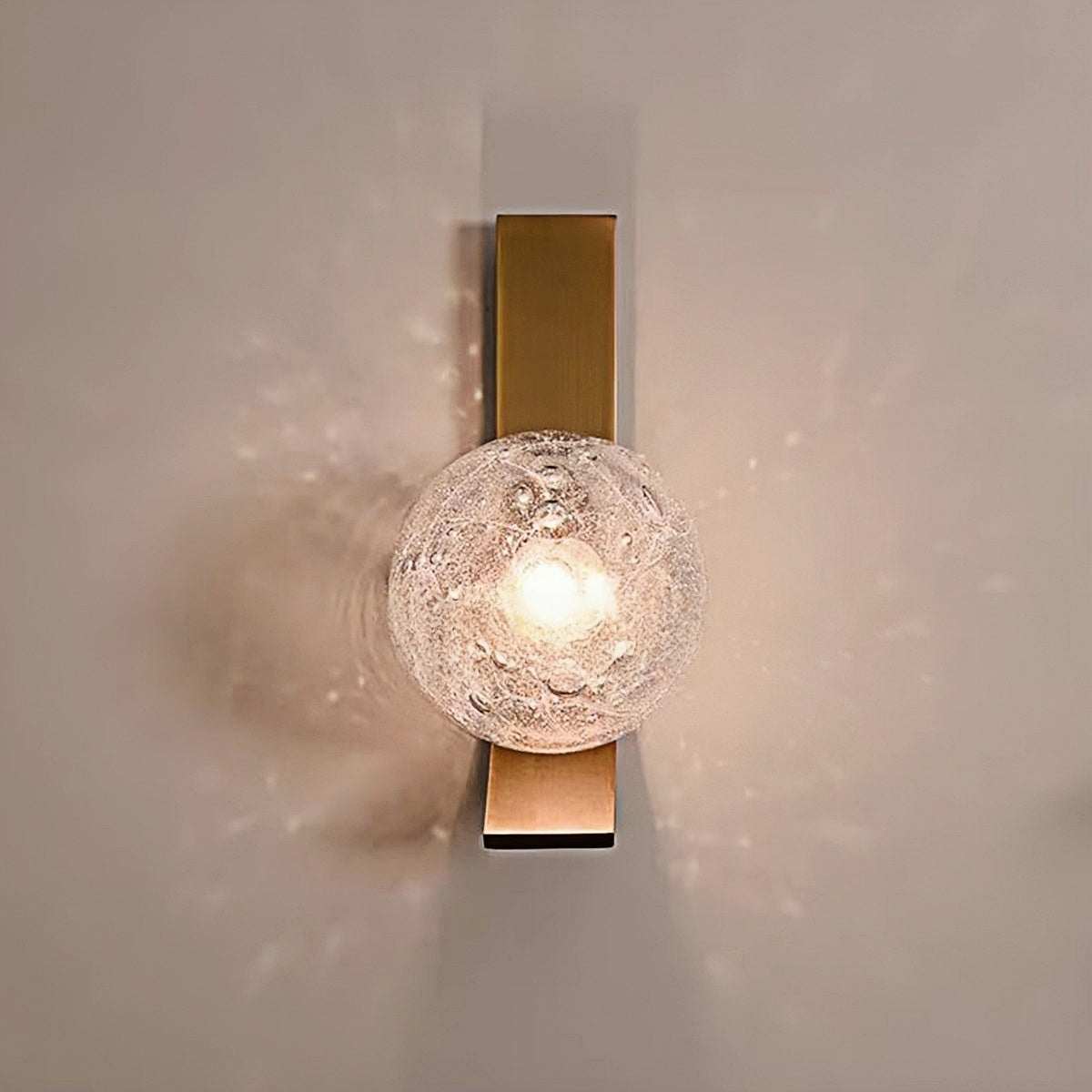 Luxury wall lamp with vintage bubble glass and warm LED lighting mounted on a sleek iron frame
