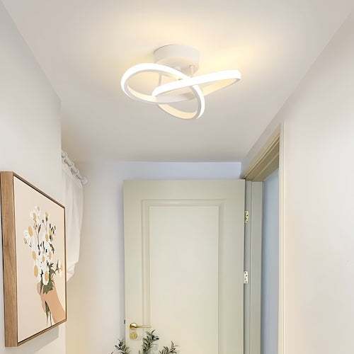 Modern LED chandelier ceiling light with energy-efficient bulbs and brushed metal finish in a minimalist room setting
