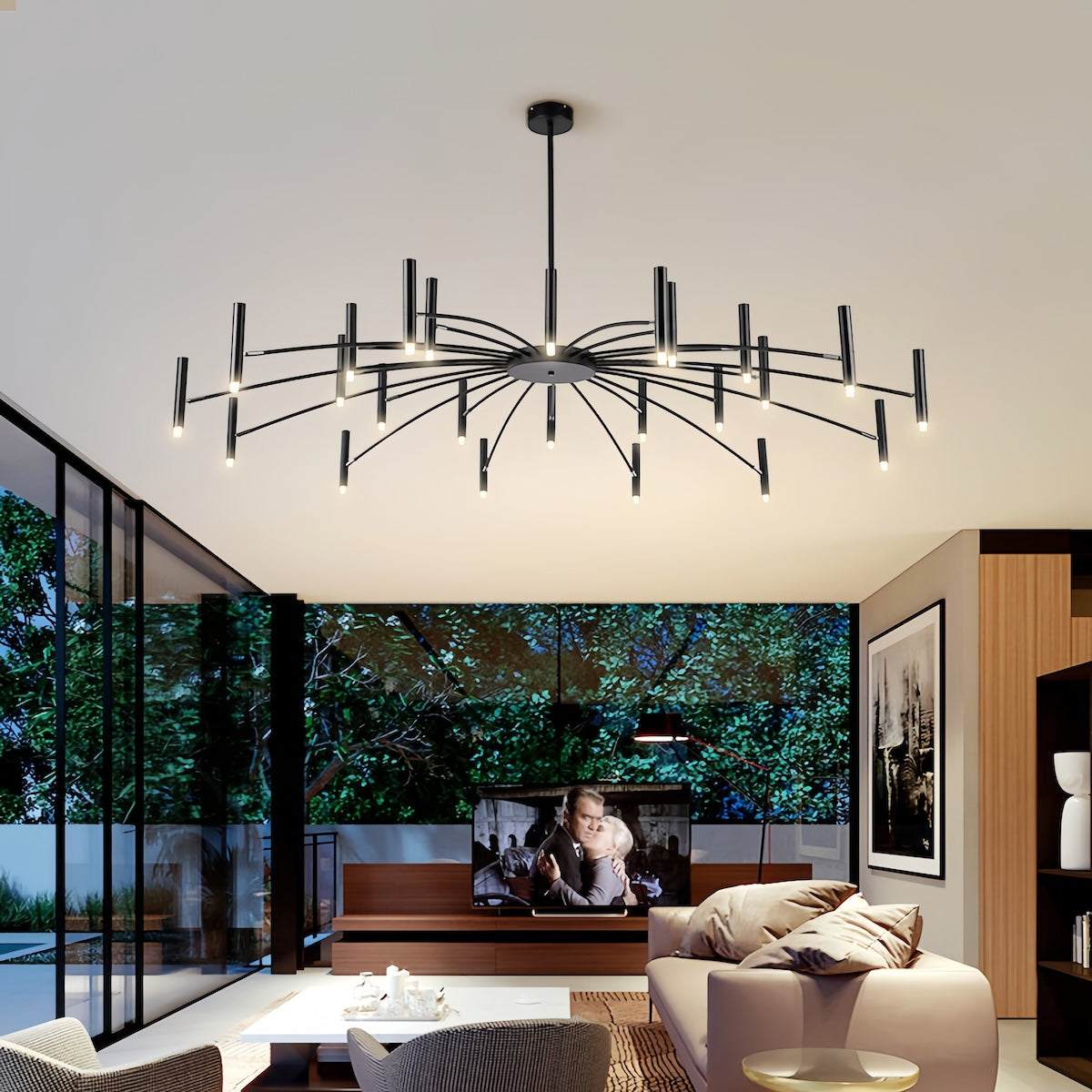 Modern black metal dining room chandelier with adjustable candle-style LED lights hanging in contemporary living space