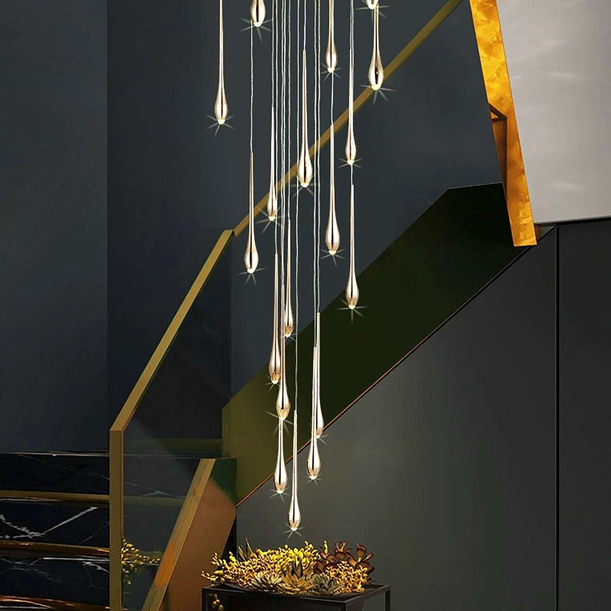 Minimalist LED chandelier with teardrop-shaped lights hanging over staircase in modern living room