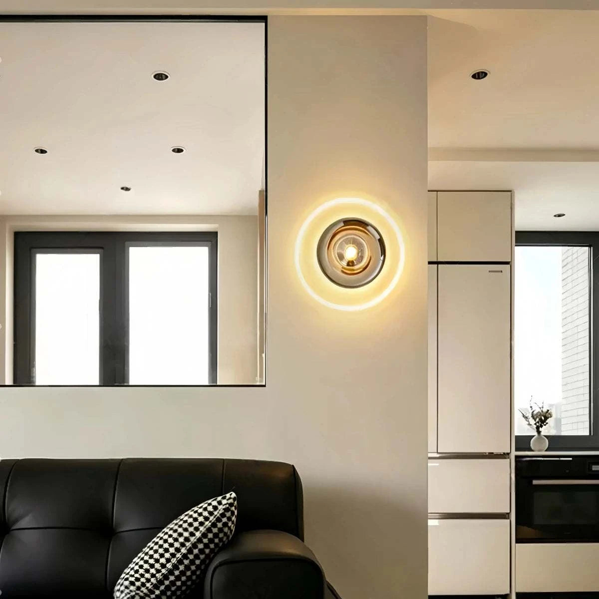 Bauhaus glass wall sconce with hand-blown gradient shade and LED circular projection light on hallway wall