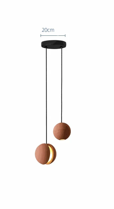 Concrete moon pendant light with fish-shaped stone design and warm ambient LED lighting