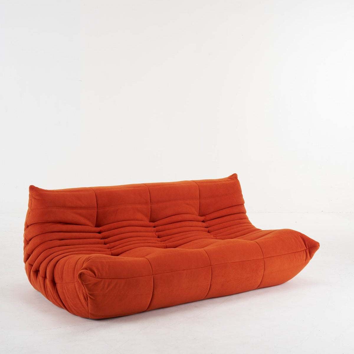 Orange suede Togo Couch 3-Seater sofa with ergonomic design and plush cushioning