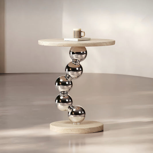 Modern round accent table with yellow travertine top and stainless steel sphere base