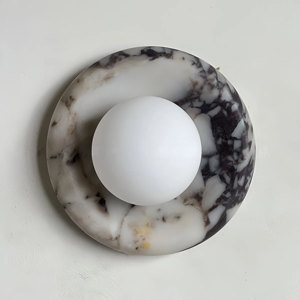 Natural travertine marble wall sconce with textured yellow marble and warm LED light for hotel and bedroom lighting