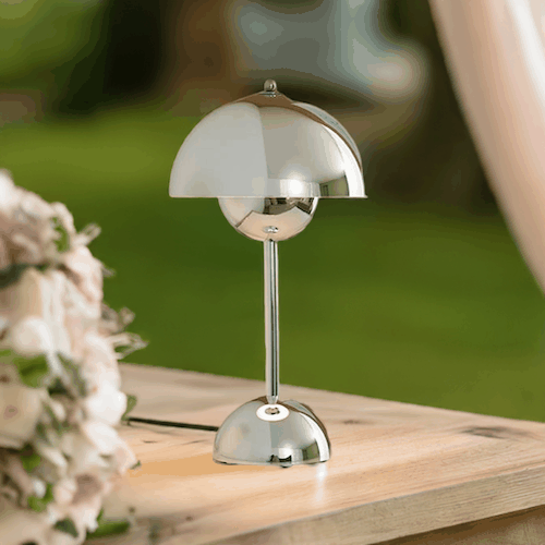 Scandi Table Lamp with mushroom-shaped metallic shade and sleek base on wooden desk