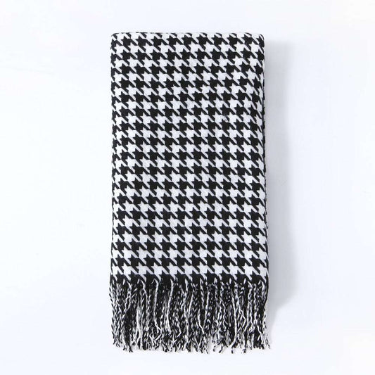 Black and white herringbone knit throw blanket with tasselled edges, eco-friendly woven design