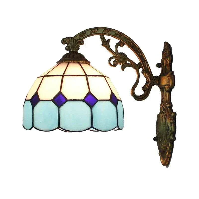 Vintage European style stained glass wall sconce with blue and purple glass shades and ornate bronze metal arm