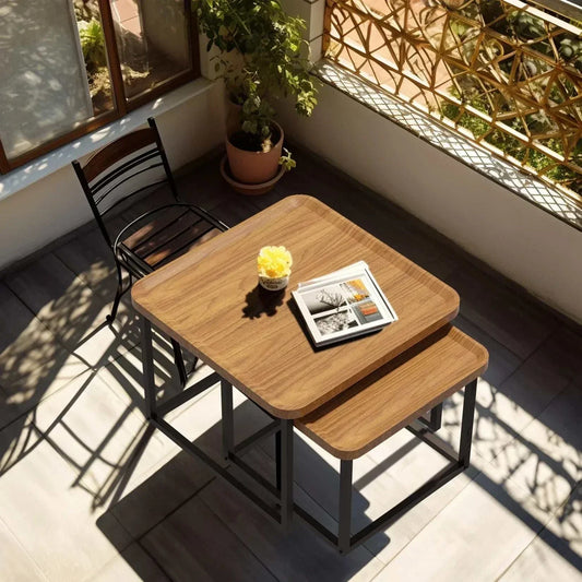 Modern square coffee table set of two with walnut wood tops and black metal frames in sunlit living space