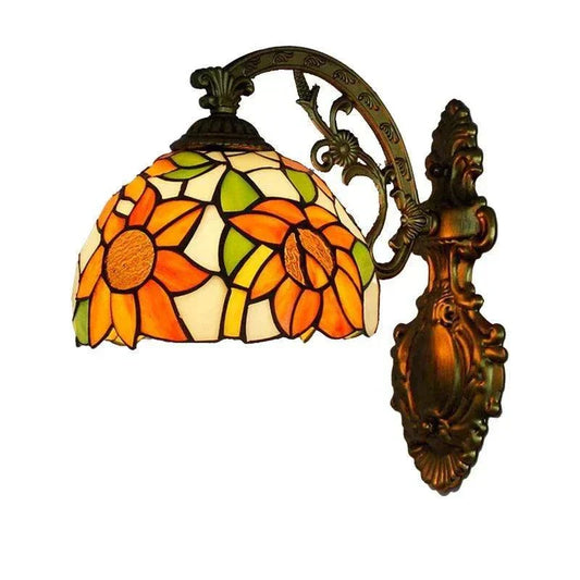 Tiffany style stained glass wall sconce with floral design and bronze finish