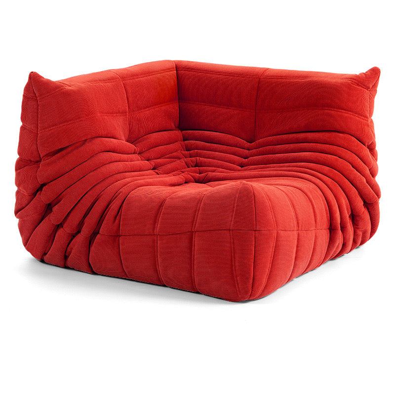 Red Caterpillar corduroy corner sofa with plush, cozy upholstery for modern living spaces